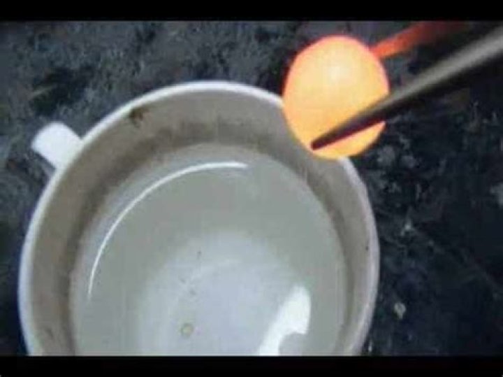 A red hot ball of nickel is dropped in a cup of water
